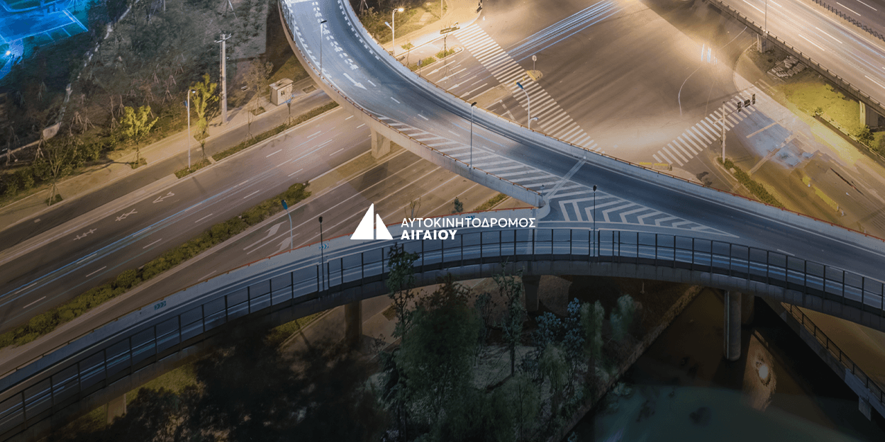 Aerial night view of the Aegean Motorway, with the Aegean Motorway logo